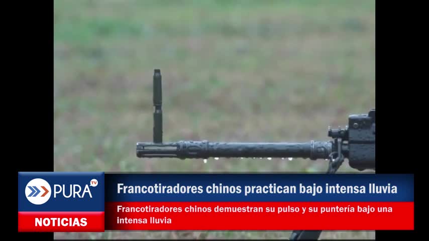 Francotiradores chinos demuestran su pulso y su puntería bajo una intensa lluvia