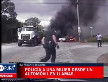 Impactante rescate de policía a una mujer desde un automóvil en llamas