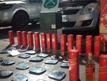 Prohíben asistir a manifestaciones a seis personas que saquearon embotelladora en Iquique