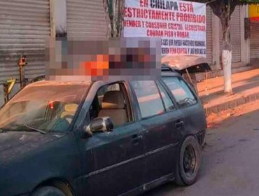 Encuentran seis cabezas sobre un vehículo junto a un cartel de advertencia en el estado mexicano de Guerrero