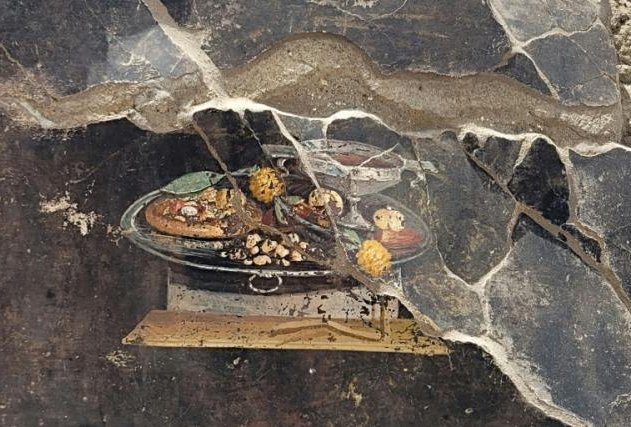 Arqueólogos encontraron en Pompeya un dibujo que podría considerarse un "ancestro de la pizza"